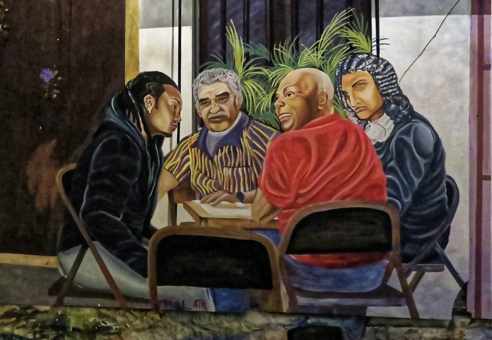 Mural de cuatro personajes jugando cartas, pintado en una pared del Café del Mural
